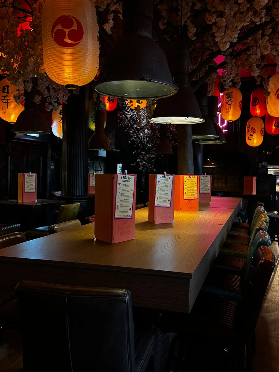 Long table lit by paper lanterns